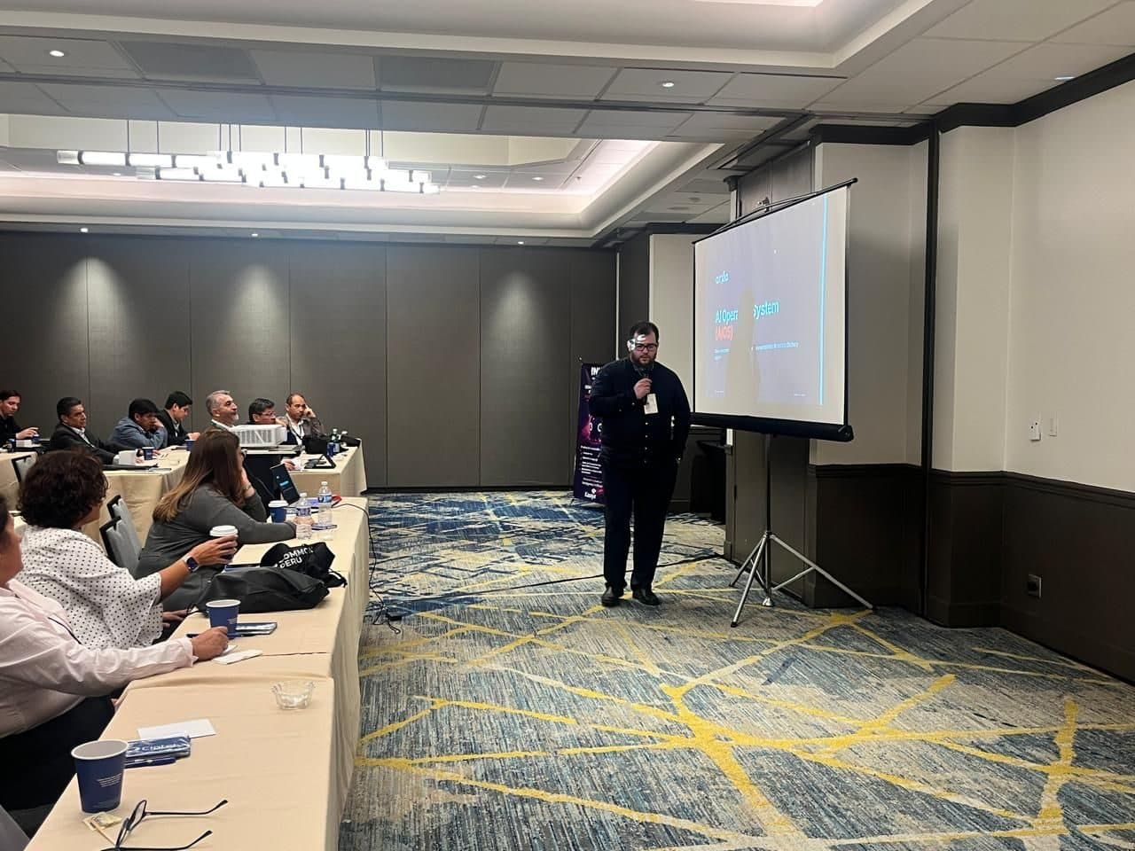 Carlos Parker of Arxia delivering his keynote at ICAC 2026 in Silicon Valley.